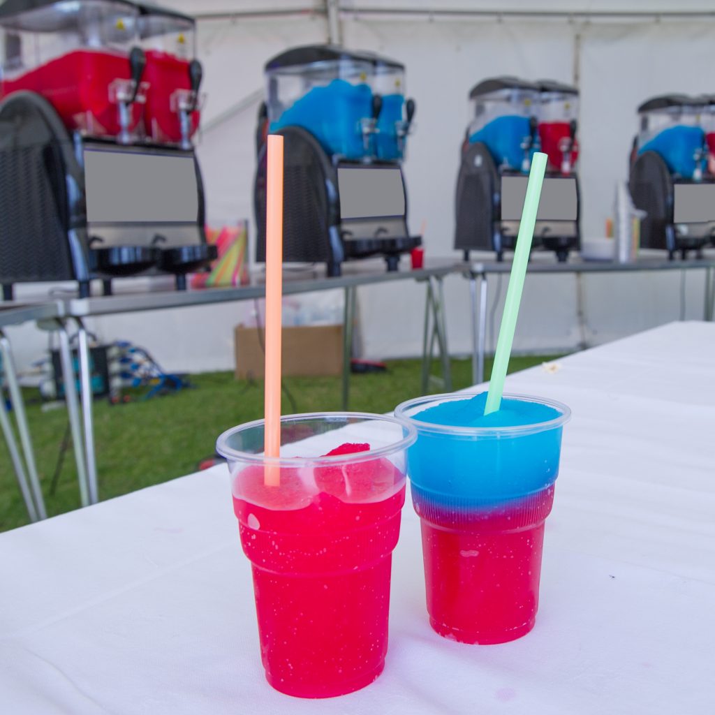 2 raspberry and blueberry flavoured slushie drinks at an event